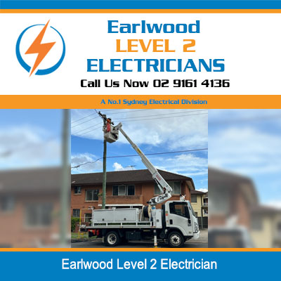Level 2 electrician servicing overhead power lines with elevated work truck in Earlwood